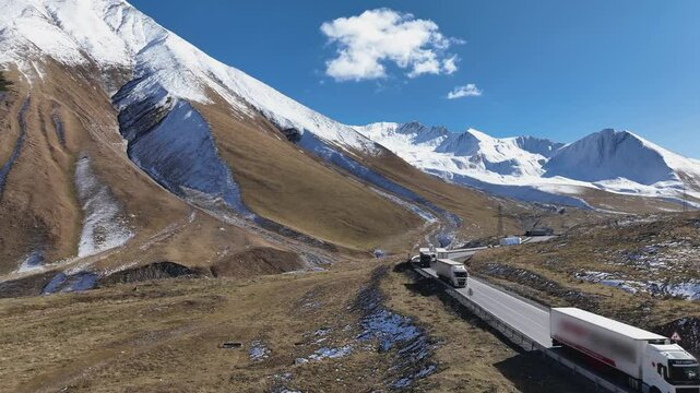 Aerial view with Lorry truck on the road surrounded by winter Landscape