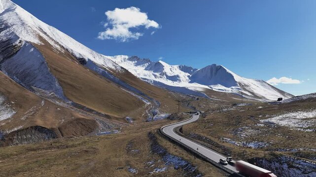 Aerial view with Lorry truck on the road surrounded by winter Landscape	