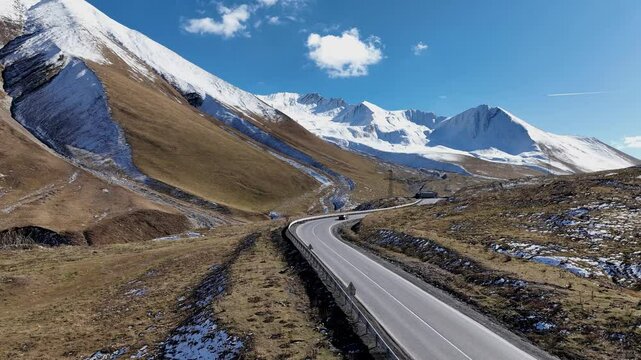 Aerial view with Lorry truck on the road surrounded by winter Landscape	