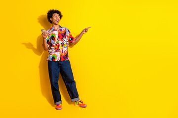 Full size photo of nice young man phone direct finger empty space wear shirt isolated on bright yellow color background