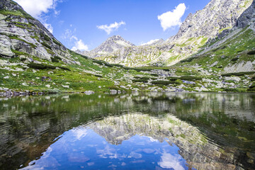 Mountain landscape in the Western Carpathians. Pond Lake Pleso nad Skokom in Mlynicka Valley, Vysoke Tatry High Tatras, Slovakia © Mareks