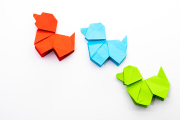 Paper dog on white background. Origami dog. Nature concept