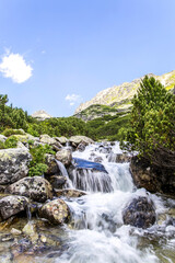 Waterfalll Skok Trail from Strbske Pleso. Mlynicka valley with stone hiking trail. High Tatras mountains in Slovakia © Mareks