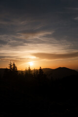 Obraz premium Beautiful sunset in the mountains. Dramatic scene. Carpathian
