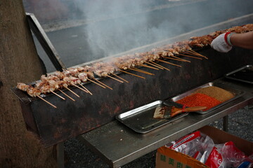 Roadside barbecue stall with abundant food