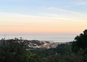 Views of the village on the coast from the top of the mountain at sunset.
