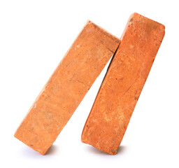 Side view of old red or orange bricks in stack isolated on white background with clipping path