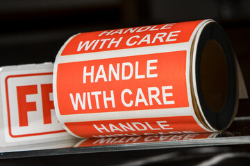 Fragile Handle With Care Sticker roll. Warning labels stickers tape