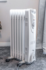 Oil filled radiator used in an room, standing in center of the room