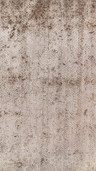 Detailed view of a rough, weathered surface featuring brown stains and irregular patterns, creating an abstract, aged appearance.