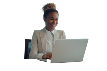 Smiling Businesswoman Working on Laptop in a Bright Office During the Day