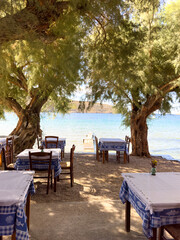 A restaurant on Vathi Beach, Sifnos. The beach stretches for more than 1 km and is a very popular place for sailboats to stop with its perfect sheltered harbour