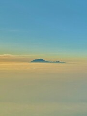 The sun rises on the eastern horizon showing the beauty of Mount Lawu