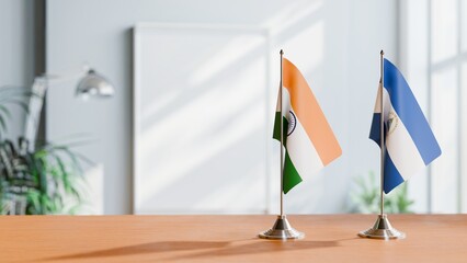 Obraz premium FLAGS OF INDIA And NICARAGUA ON TABLE