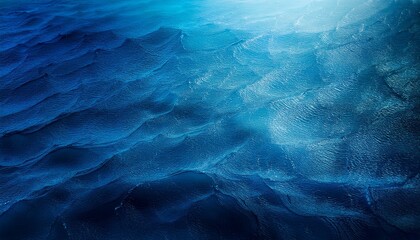 深い海のような青いグラデーション、色の濃淡が交差する神秘的なテクスチャ背景
