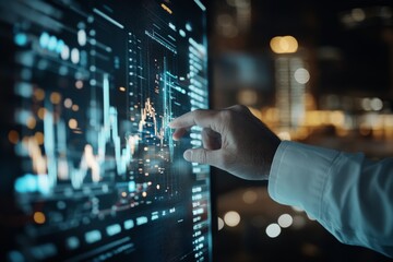 A hand interacts with a touch screen displaying stock market data in a dynamic city environment, highlighting the importance of technology in finance.