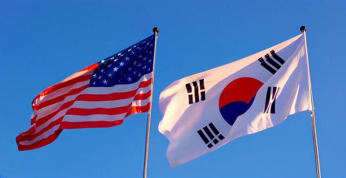 American and South Korean flags waving in the sky