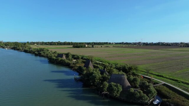 traditional reed homes in early medieval times at the Casoni di Caorle on the Nicesolo canal, north of Venice, Italy