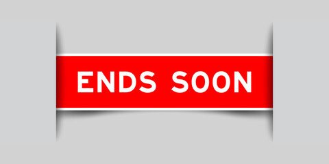 Red color square label sticker with word ends soon that inserted in gray background