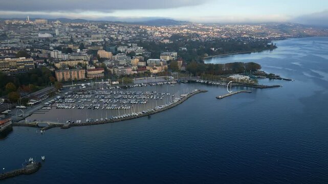 Parallax drone shot of Ouchy Port at sunset in Lausanne Switzerland