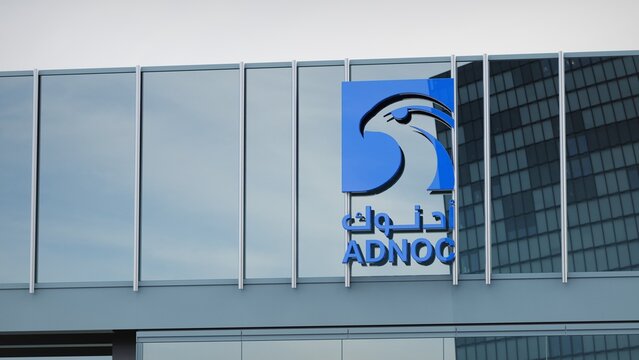 Seattle, USA - July 5, 2021 ADNOC only editorial Stock information on the logo of the office facade