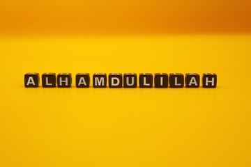 yellow background with the words alhamdulillah