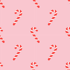 Cute Christmas seamless pattern with candy canes. Flat pink background design. Repeating print for fabric, wrapping paper, textile, wallpaper