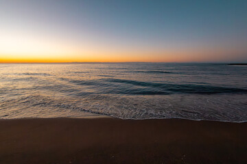 beautiful sunrise on the sea with waves