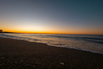 beautiful sunrise on the sea with waves