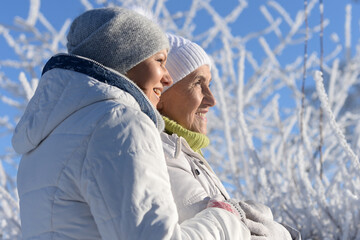 Beautiful elderly woman and her daughter enjoy winter together.