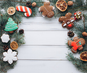 Festive Christmas Cookies and Evergreens on Rustic Background