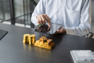 Gold Trading business man hand offering gold Investment in gold mining company or Trading gold on the stock exchange Rising gold prices.