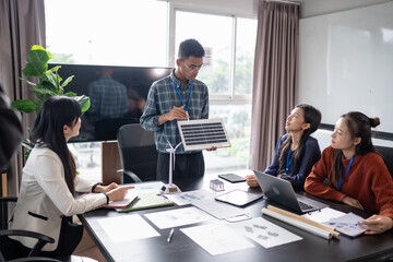 Solar panels green energy Business people working in green eco friendly office business meeting creative ideas for business eco friendly professional teaching corporate people sustainable electricity