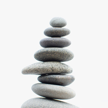 USA, New York, Lake Placid, Studio shot of stones balanced in stack