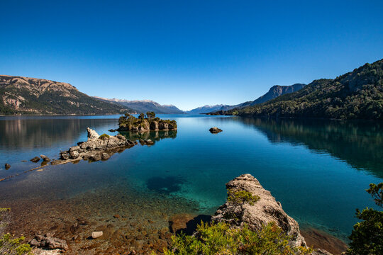 Calm Traful Lake and rock formations on Estancia Arroyo Verde