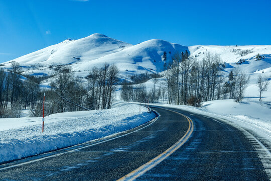 Winding interstate at snow covered foothills