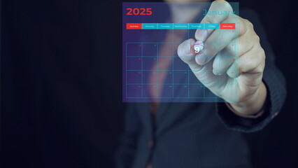 January 2025.Businessman using pen to writing circle mark on virtual calendar agenda of booking and appointment meeting concept.