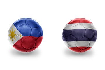Fototapeta premium football balls with national flags of thailand and philippines ,soccer teams. on the white background.