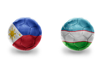 football balls with national flags of uzbekistan and philippines ,soccer teams. on the white background.