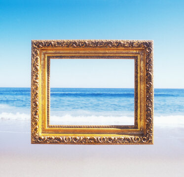 USA, New Jersey, Spring Lake, Golden ornate picture frame against beach and sea