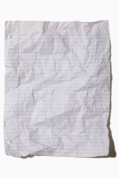 USA, New York State, New York City, Crumpled lined paper on white background
