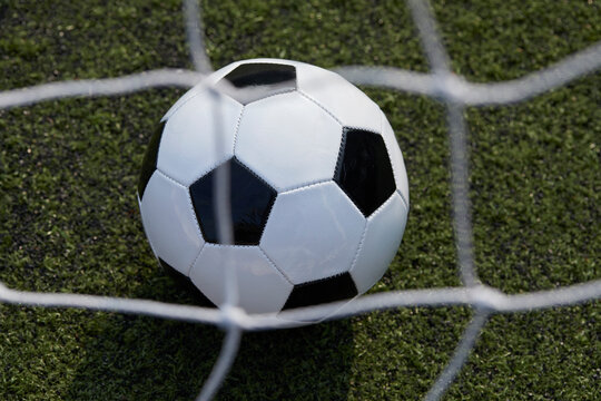 USA, New York State, New York City, Close-up of soccer ball on turf field