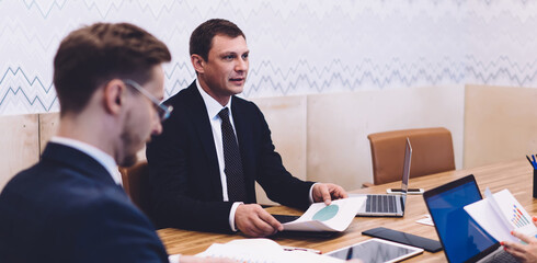 Business partners having discussion during meeting in conference room