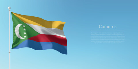 Waving Flag of Comoros Against Clear Blue Sky Copyspace