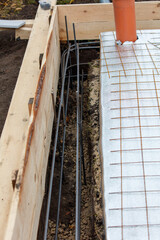 A wooden structure with a metal pipe coming out of it