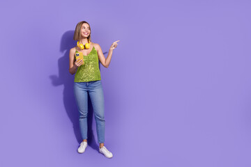 Photo of cute woman wear stylish sequins clothes recommend empty space isolated on purple color background