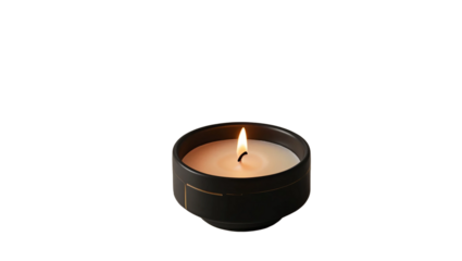 A lit candle placed inside a geometric black ceramic holder, featuring a modern and minimalist design. The flame emits a warm glow. Isolated on transparent background