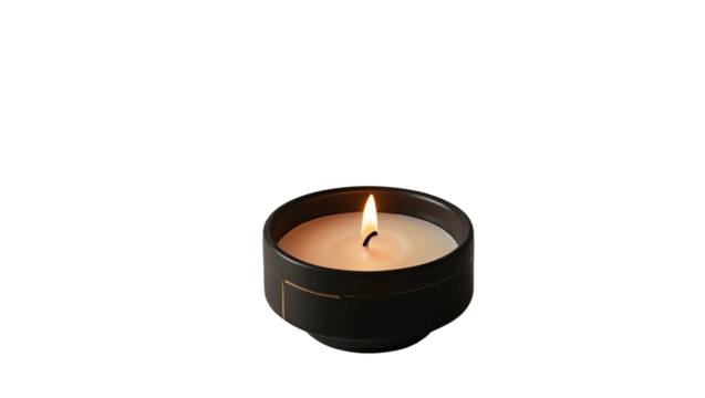 A lit candle placed inside a geometric black ceramic holder, featuring a modern and minimalist design. The flame emits a warm glow. Isolated on transparent background