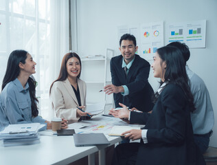 Collaborative Business Meeting:  A group of professional colleagues engage in a lively discussion during a meeting, showcasing teamwork, communication.