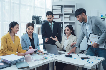 Collaborative Business Meeting: A diverse team of young professionals engages in a productive meeting, showcasing teamwork, collaboration, and strategic planning within a modern office setting.  